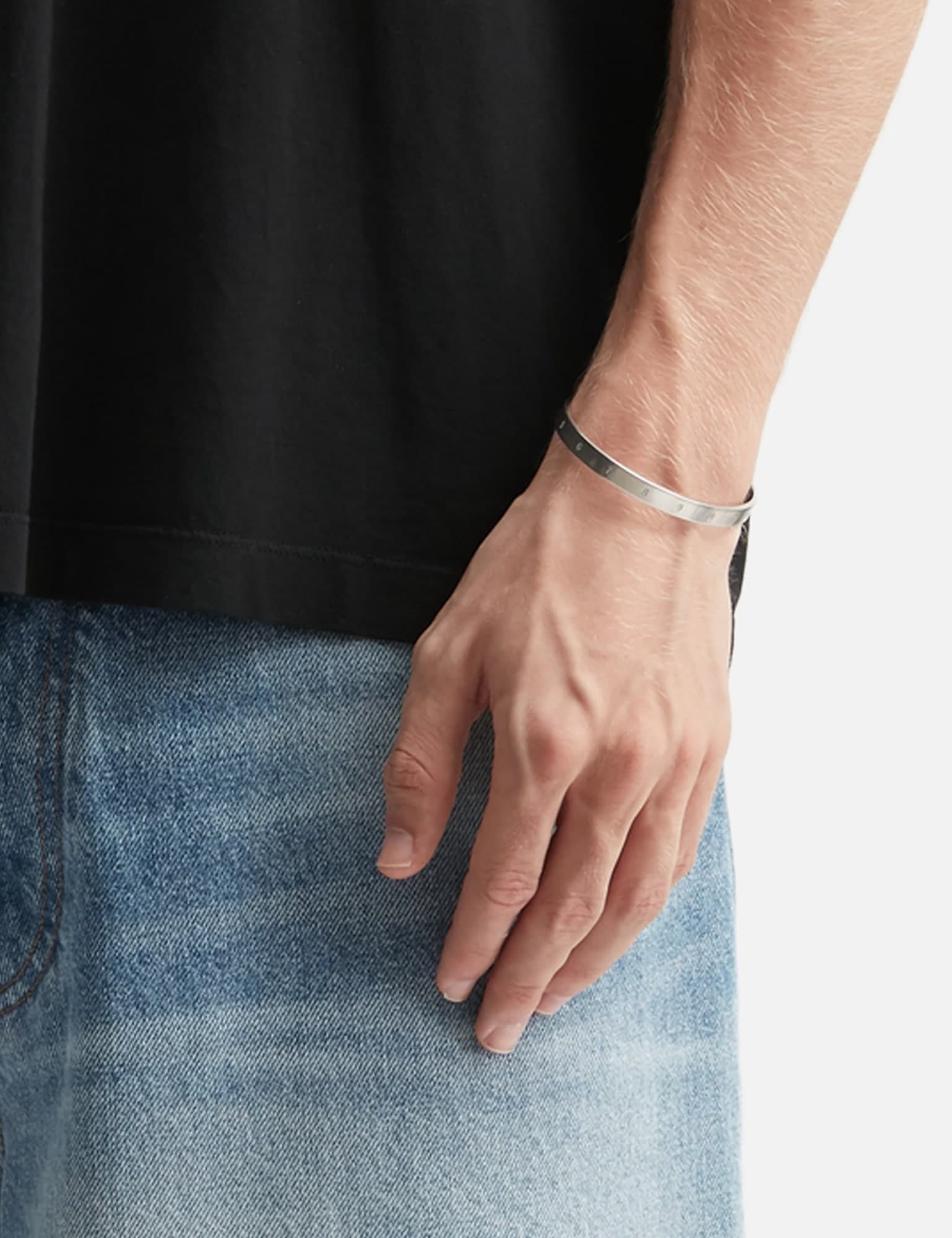 Maison Margiela Numeric cuff worn on the wrist